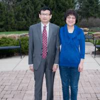 Award winner poses with wife (outdoors)